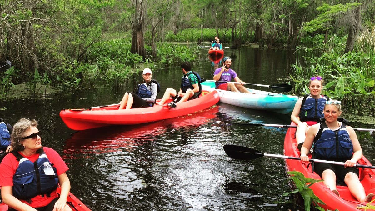 Posy Musgrave, Sharon Lynch riding on the back of a boat
